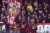 Salernitana's Lassana Coulibaly, left, celebrates scoring during the Serie A soccer match between Salernitana and Monza at Arechi stadium, Salerno, Italy, Sunday Feb. 26, 2023. (Alessandro Garofalo/LaPresse via AP)