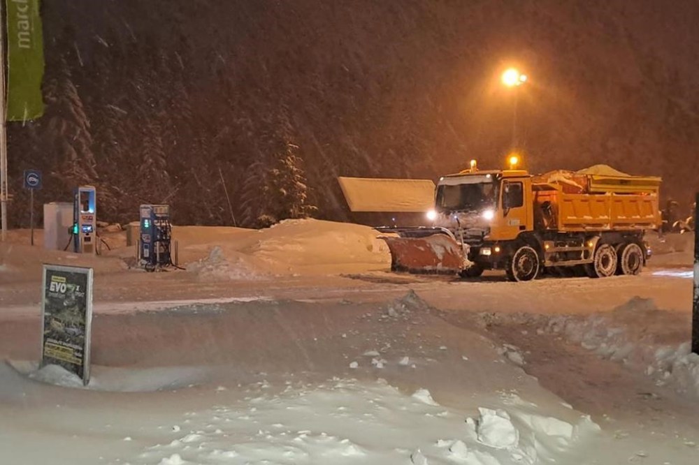 A snowplow moves snow at a gas station near Ravna Gora, Croatia, early Monday, Feb. 27, 2023. Hundreds of people in Croatia have spent the night in their cars or in cafes and reception centers after a snow storm on weekend caused a traffic collapse and left parts of the country cut off. (AP Photo)
