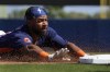 Houston Astros' Corey Julks reaches for third as he dives in for a triple during the second inning of a spring training baseball game against the Miami Marlins Monday, Feb. 27, 2023, in West Palm Beach, Fla. (AP Photo/Jeff Roberson)