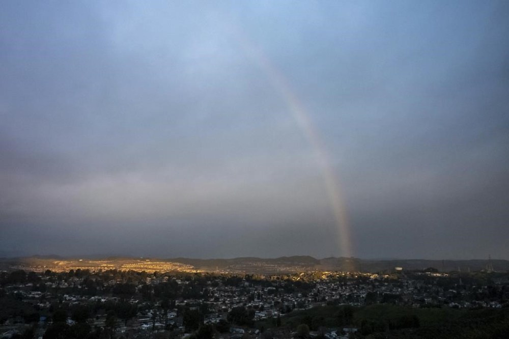 A partial rainbow appears over the Santa Clarita Valley Monday, Feb. 27, 2023, in Calif. Showers are forecast for the area through Wednesday. (David Crane/The Orange County Register via AP)