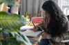 Priscilla Molina creates a custom signature in Los Angeles on Wednesday, Feb. 22, 2023. Molina designs a minimum of 300 custom signatures a month, offering packages that include up to three ways to sign, limitless drafts or a new set of initials. (AP Photo/Ashley Landis)