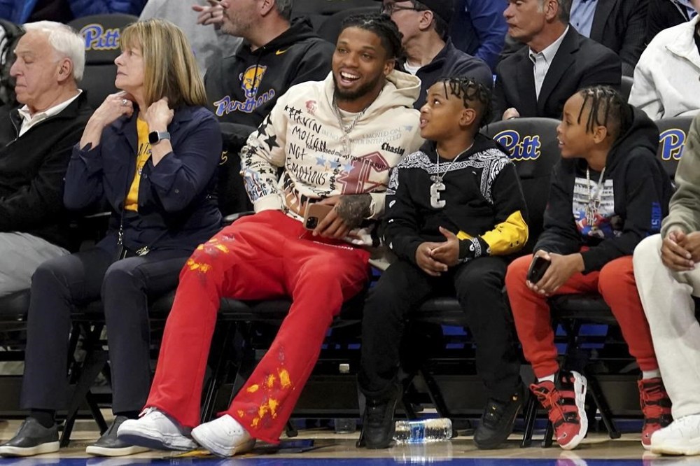 Buffalo Bills safety Damar Hamlin watches as Pittsburgh takes on Georgia Tech during the first half of an NCCA college basketball game in Pittsburgh, Tuesday, Feb. 21, 2023. (AP Photo/Matt Freed)