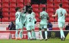 Brighton and Hove Albion's Evan Ferguson, second left, celebrates scoring with teammates during the English FA Cup fifth round soccer match at the bet365 Stadium, Stoke-on-Trent, England, Tuesday Feb. 28, 2023. (Nigel French/PA via AP)
