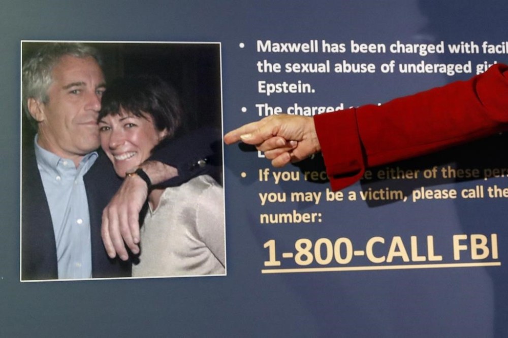 FILE - Audrey Strauss, acting U.S. Attorney for the Southern District of New York, points to a photo of Jeffrey Epstein and Ghislaine Maxwell during a news conference, in New York on July 2, 2020. Maxwell says a federal appeals court should reverse her conviction on charges that she joined and enabled the sexual abuse that Epstein committed on scores of teenagers and young women. The arguments her lawyers submitted Tuesday, Feb. 28, 2023, to the 2nd U.S. Circuit Court of Appeals largely repeated claims she unsuccessfully made to a trial judge who sent her to prison for 20 years.( AP Photo/John Minchillo, File)