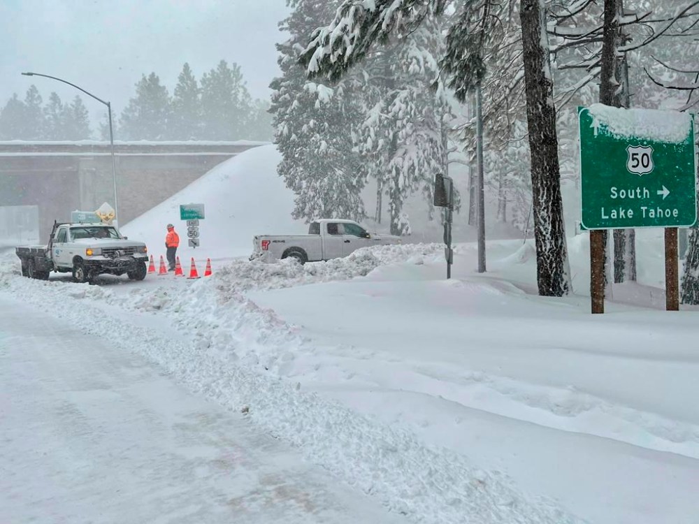 In this image released by Caltrans District 3, Highway 50 is closed to all traffic between Pollock Pines and Meyers due to low visibility, spinouts and avalanche control work in Pollock Pines in El Dorado County, Calif., Tuesday, Feb. 28, 2023. Beleaguered Californians got hit again Tuesday as a new winter storm moved into the already drenched and snow-plastered state, with blizzard warnings blanketing the Sierra Nevada and forecasters warning residents that any travel was dangerous. (Caltrans District 3 via AP)