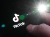 The TikTok startup page is displayed on an iPhone in Ottawa on Monday, Feb. 27, 2023. The Saskatchewan government is banning the use of TikTok on government-owned devices pending the results of a threat assessment by the federal government. THE CANADIAN PRESS/Sean Kilpatrick