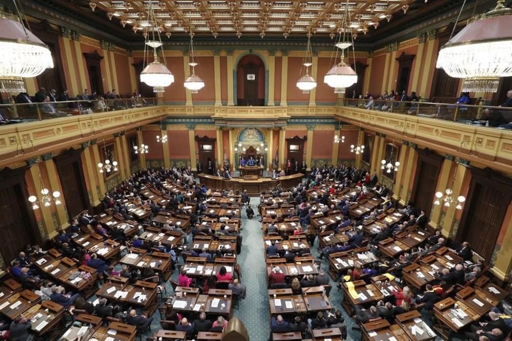 FILE - Michigan Gov. Gretchen Whitmer delivers her State of the State address to a joint session of the House and Senate on Jan. 25, 2023, at the state Capitol in Lansing, Mich. Michigan is looking to expand the state’s civil rights law to include the LGBTQ community, with state senators voting Wednesday, March 1, 2023, to prohibit discrimination based on sexual orientation, gender identity or expression. (AP Photo/Al Goldis, File)