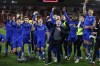 Grimsby's coach Paul Hurst celebrates with his players after winning the English FA Cup fifth round soccer match between Southampton and Grimsby Town at St Mary's Stadium in Southampton, England Wednesday, March 1, 2023. Grimsby Town won 2-1. (AP Photo/David Cliff)