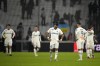 Marseille players react at the end of the French League One soccer match between Marseille and Paris Saint-Germain at the Velodrome stadium in Marseille, southern France, Sunday, Feb. 26, 2023. (AP Photo/Daniel Cole)