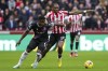 Crystal Palace's Marc Guehi, left, and Brentford's Ivan Toney battle for the ball during their English Premier League soccer match at the Gtech Community Stadium, London, Saturday, Feb. 18, 2023. (John Walton/PA via AP)