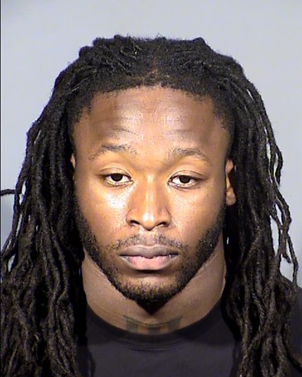 FILE - This Clark County, Nev., Detention Center booking photo shows New Orleans Saints running back Alvin Kamara following his arrest on Feb. 6, 2022, in Las Vegas. Kamara, Cincinnati Bengals cornerback Chris Lammons and co-defendants Darrin Young and Percy Harris pleaded not guilty in state court in Nevada on Thursday March 2, 2023, to charges they beat a man unconscious at a Las Vegas Strip nightclub before the NFL’s 2022 Pro Bowl. (Clark County Detention via AP, File)