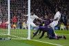 Real Madrid's Eder Militao, top right, scores an own goal past his goalkeeper during the Spanish Copa del Rey semi final, first leg soccer match between Real Madrid and Barcelona at Santiago Bernabeu stadium in Madrid, Spain, Thursday, March 2, 2023. (AP Photo/Manu Fernandez)