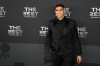 FILE - Moroccan player Achraf Hakimi poses on the green carpet before the ceremony of the Best FIFA Football Awards in Paris, France, Monday, Feb. 27, 2023. French prosecutors said Friday that Paris Saint-Germain defender and Morocco international star Achraf Hakimi has been indicted on rape charges. (AP Photo/Michel Euler, File)