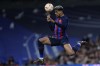 Barcelona's Ronald Araujo heads the ball during the Spanish Copa del Rey semi final, first leg soccer match between Real Madrid and Barcelona at Santiago Bernabeu stadium in Madrid, Spain, Thursday, March 2, 2023. (AP Photo/Manu Fernandez)