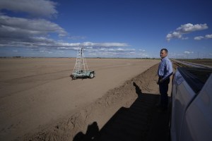 Tom Brundy looks over a field that is in preparation for planting at his farm Tuesday, Feb. 28, 2023, near Calexico, Calif. Brundy, an alfalfa grower in California's Imperial Valley, thinks farmers reliant on the shrinking Colorado River can do more to save water and use it more efficiently. But one practice that's off-limits for Brundy is fallowing — leaving fields unplanted to spare the water that would otherwise irrigate crops. (AP Photo/Gregory Bull)