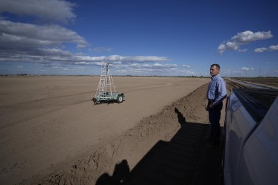 Tom Brundy looks over a field that is in preparation for planting at his farm Tuesday, Feb. 28, 2023, near Calexico, Calif. Brundy, an alfalfa grower in California's Imperial Valley, thinks farmers reliant on the shrinking Colorado River can do more to save water and use it more efficiently. But one practice that's off-limits for Brundy is fallowing — leaving fields unplanted to spare the water that would otherwise irrigate crops. (AP Photo/Gregory Bull)