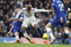 Chelsea's Mateo Kovacic, left, and Leeds United's Georginio Rutter challenge for the ball during the English Premier League soccer match between Chelsea and Leeds United at at the Stamford Bridge stadium in London, Saturday, March 4, 2023. (AP Photo/David Cliff)