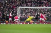 Arsenal's goalkeeper Aaron Ramsdale, center, fails to save the ball as Bournemouth's Marcos Senesi scores his side's 2nd goal during the English Premier League soccer match between Arsenal and Bournemouth at the Emirates stadium in London, England, Saturday, March 4, 2023. (AP Photo/Kin Cheung)
