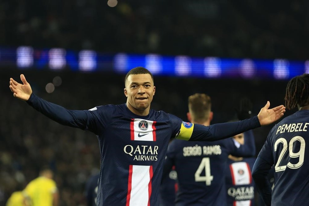 PSG's Kylian Mbappe celebrates after scoring his side's fourth goal during the French League One soccer match between Paris Saint-Germain and Nantes at the Parc des Princes in Paris, Saturday, March 4, 2023. (AP Photo/Aurelien Morissard)