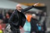 AC Milan's manager Stefano Pioli calls out to his players during a Serie A soccer match between AC Milan and Atalanta, at Milan's San Siro Stadium, Sunday, Feb. 26, 2023. (AP Photo/Antonio Calanni)