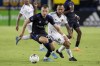 CF Montreal defender Alistair Johnston, left, takes the ball away from LA Galaxy midfielder Victor Vazquez during the second half of an MLS soccer match in Carson, Calif., Monday, July 4, 2022.&nbsp;Johnston scored his first goal for Celtic in a 5-1 win over St. Mirren in Scottish league play Sunday. THE CANADIAN PRESS/AP-Alex Gallardo