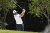 Captain Dustin Johnson of 4Aces GC hits his shot from a bunker on the fifth hole during the final round of the LIV Golf Mayakoba at El Camaleón Golf Course, Sunday, Feb. 26, 2023, in Playa del Carmen, Mexico. (Photo by Jon Ferrey/LIV Golf via AP)