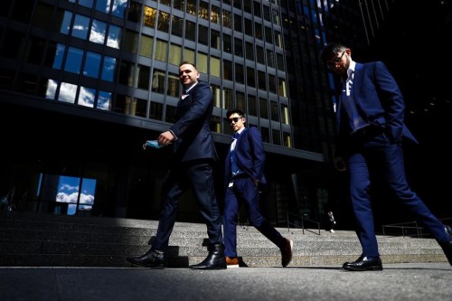 A group of men walk in the financial district in Toronto on Wednesday, September 29, 2021. A new survey suggests Canadian men are almost twice as likely as women to think gender inequality is being 