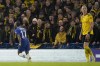 Chelsea's Raheem Sterling, left, celebrates after scoring his sides first goal during the Champions League round of 16 second leg soccer match between Chelsea FC and Borussia Dortmund at Stamford Bridge, London, Tuesday March 7, 2023. (AP Photo/Alastair Grant)