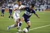 Vancouver Whitecaps midfielder Ryan Raposo, right, fights off Los Angeles Galaxy midfielder Marco Delgado, left, during the first half of an MLS soccer match in Carson, Calif., Saturday, Aug. 13, 2022. The Vancouver Whitecaps had a knack for performing on the big stage last season. THE CANADIAN PRESS/AP-Raul Romero Jr.