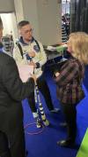 Curling Canada
                                Cathy Gauthier (right) speaks with her son Jacques at the Brier.