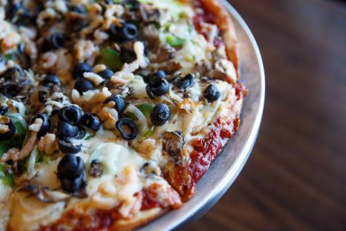 MIKE DEAL / WINNIPEG FREE PRESS
                                The Royal Special pizza, created in 1975, is loaded with pepperoni, mushroom, ham, green pepper, shrimp, black olive and onion.