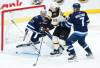JOHN WOODS / THE CANADIAN PRESS
                                Boston Bruins’ Tyler Bertuzzi (59) attempts to tip the puck past Winnipeg Jets goaltender Connor Hellebuyck (37) as Vladislav Namestnikov (7) defends during second period NHL action in Winnipeg.