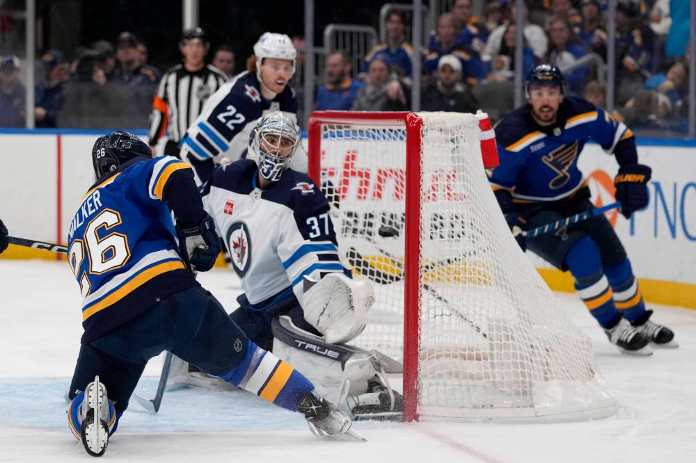 JEFF ROBERSON / THE ASSOCIATED PRESS
St. Louis Blues’ Nathan Walker (26) scores past Winnipeg Jets goaltender Connor Hellebuyck (37) during the second period.