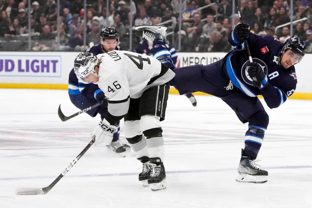 MARCIO JOSE SANCHEZ / THE ASSOCIATED PRESS
Winnipeg Jets center Mark Scheifele, right, collides with Los Angeles Kings center Blake Lizotte during the first period.