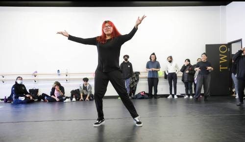 RUTH BONNEVILLE / WINNIPEG FREE PRESS
                                Madi Ottertail from Lac la Croix First Nation shows students at Outside Looking In a dance from a previous year.