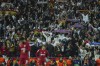 Real Madrid fans cheer after Real Madrid's Karim Benzema scores his side's fifth goal during the Champions League, round of 16, first leg soccer match between Liverpool and Real Madrid at the Anfield stadium in Liverpool, England, Tuesday, Feb. 21, 2023. (AP Photo/Jon Super)