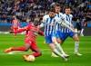 Augsburg's Kelvin Yeboah, left fights for the ball against Hertha's Agustin Maximiliano Rogel Paita during a German Bundesliga match between Hertha BSC Berlin and FC Augsburg in Berlin, Germany, Saturday, Feb.25, 2023. Soeren Stache/dpa via AP)