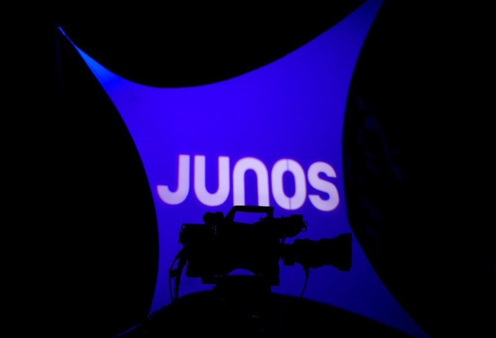 A video camera is silhouetted as people gather for a press conference for the 2023 Juno Award nominee announcement in Toronto, Tuesday, Jan. 31, 2023. The Canadian Academy of Recording Arts and Sciences announced the Juno Awards will be returning to Halifax for the first time since 2006. THE CANADIAN PRESS/Nathan Denette