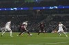 AC Milan's Brahim Diaz tries to hold off Tottenham's Ivan Perisic during the Champions League round of 16 second leg soccer match between Tottenham Hotspur and AC Milan at the Tottenham Hotspur stadium in London, Wednesday, March 8, 2023. (AP Photo/Alastair Grant)