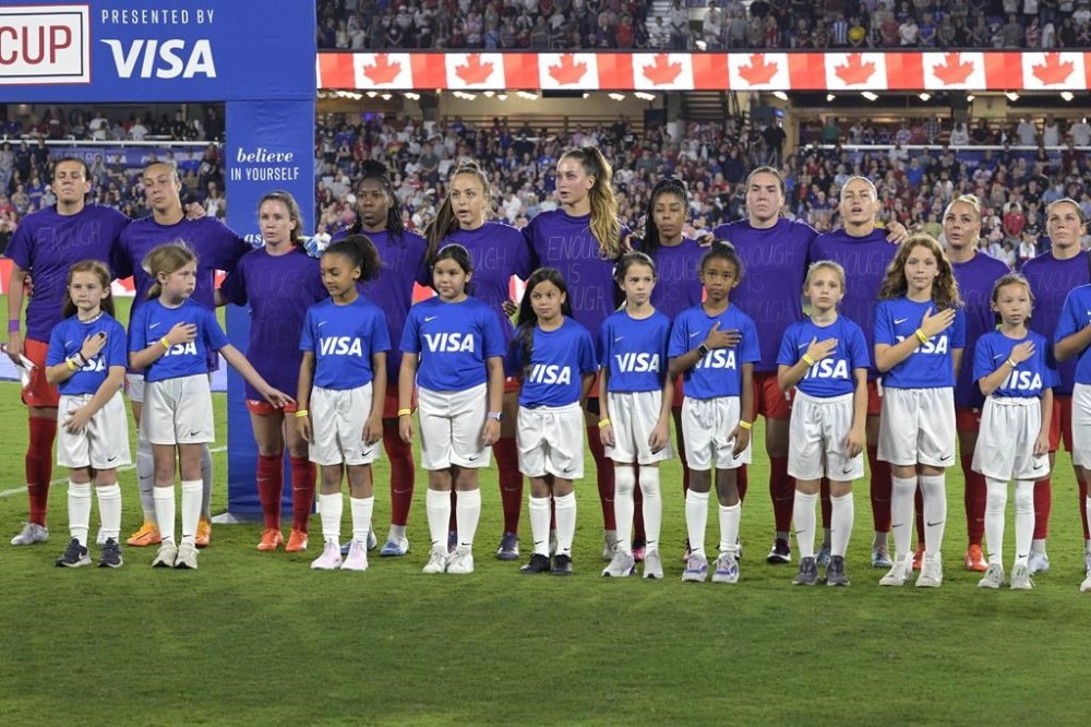 Canada players wear purple shirts with