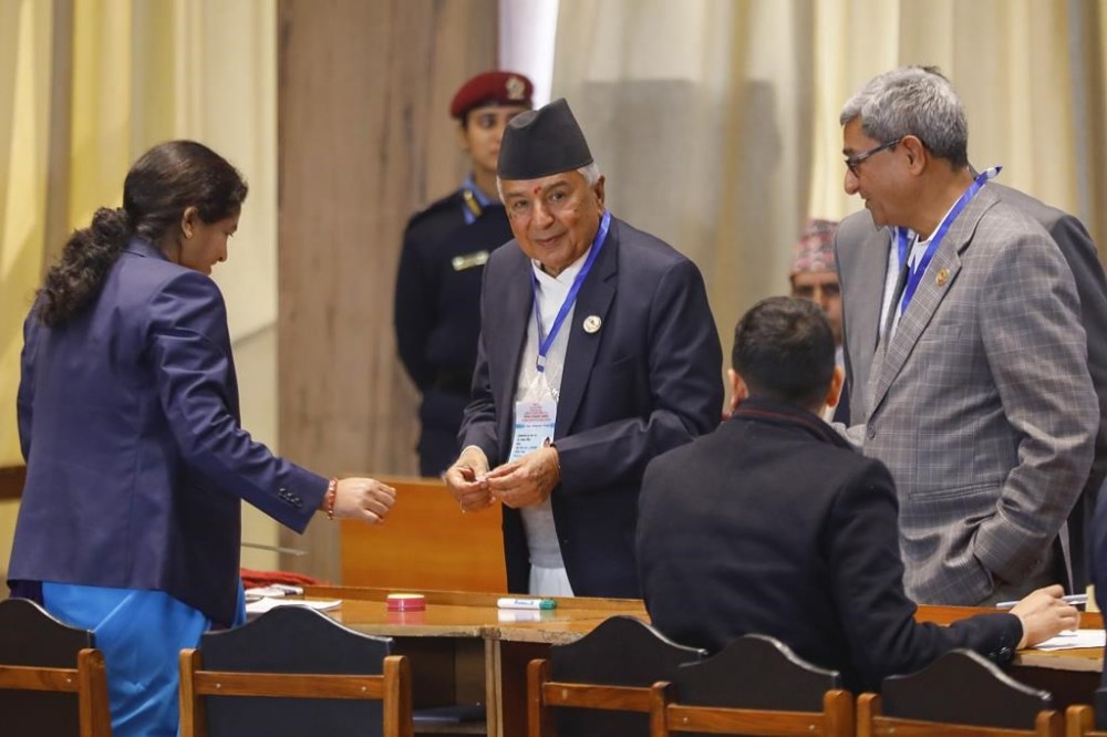 Presidential candidate Ram Chandra Poudel of the Nepali Congress party await to cast his vote for elect Nepal's new president in Kathmandu, Nepal, Thursday, March 9, 2023. Nepal's parliament members lined up Thursday to elect a new president the third one since the Himalayan nation abolished a centuries-old monarchy and the country was turned into a republic. The election for the president has fuelled feuds among the main political parties and triggered political uncertainty.(AP Photo/Bikram Rai)