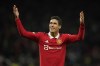 Manchester United's Raphael Varane celebrates at the end of the Europa League playoff second leg soccer match between Manchester United and Barcelona at Old Trafford stadium in Manchester, England, Thursday, Feb. 23, 2023. Manchester United won 2-1. (AP Photo/Dave Thompson)