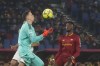 Juventus' goalkeeper Wojciech Szczesny, left, makes a save in front of Roma's Tammy Abraham during the Italian Serie A soccer match between Roma and Juventus at Olympic Stadium, in Rome, Italy, Sunday, March 5, 2023. (AP Photo/Gregorio Borgia)