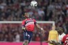 Lille's Jonathan David heads the ball during the French League one soccer match between Lille and Monaco at the Pierre Mauroy stadium in Villeneuve d'Ascq, northern France, Sunday, Oct. 23, 2022.&nbsp;Canadian striker Jonathan David notched a hat trick for Lille to become the top scorer in the French league and Lyon substitute Alexandre Lacazette netted two late goals to salvage a 3-3 draw on Friday. THE CANADIAN PRESS/AP, Michel Spingler