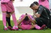 Espanyol's Oscar Gil, center, receives medical aid during a Spanish La Liga soccer match between Real Madrid and Espanyol at the Santiago Bernabeu stadium in Madrid, Spain, Saturday, March 11, 2023. (AP Photo/Bernat Armangue)