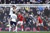 Tottenham's Harry Kane, top left, scores his side's opening goal during the English Premier League soccer match between Tottenham Hotspur and Nottingham Forest, at the Tottenham Hotspur stadium in London, Saturday, March 11, 2023. (AP Photo/Leila Coker)