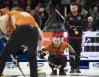 Wild Card 1 skip Brendan Bottcher (front) and Ontario skip Mike McEwen keep a close eye on a shot during their 3-4 playoff game at the 2023 Tim Hortons Brier in London, Ont. on Saturday March 11, 2023.THE CANADIAN PRESS/Frank Gunn