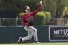 Arizona Diamondbacks left fielder Corbin Carroll throws the ball back to the infield after making a catch on a fly ball hit by Los Angeles Dodgers' J.D. Martinez during the second inning of a spring training baseball game Thursday, March 2, 2023, in Phoenix. (AP Photo/Ross D. Franklin)