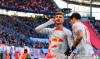 Leipzig's Timo Werner, left, celebrates scoring with teammate Dominik Szoboszlai during a German Bundesliga soceer match between RB Leipzig and Borussia Moenchengladbach in Leipzig, Germany, Saturday, March 11, 2023. (Jan Woitas/dpa via AP)