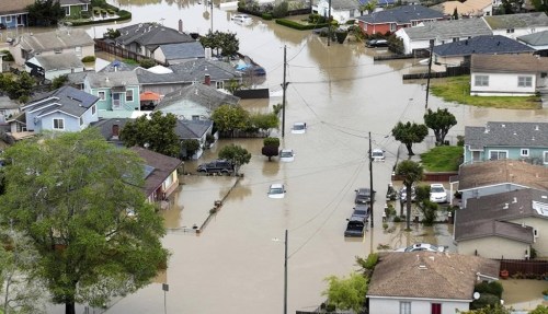 Floodwaters cover most of Pajaro Valley, Calif., on Sunday, March 12, 2023. An atmospheric river storm broke through a levee along the Pájaro river inundating homes and businesses and leaving thousands of people without shelter. (Shae Hammond/Bay Area News Group via AP)